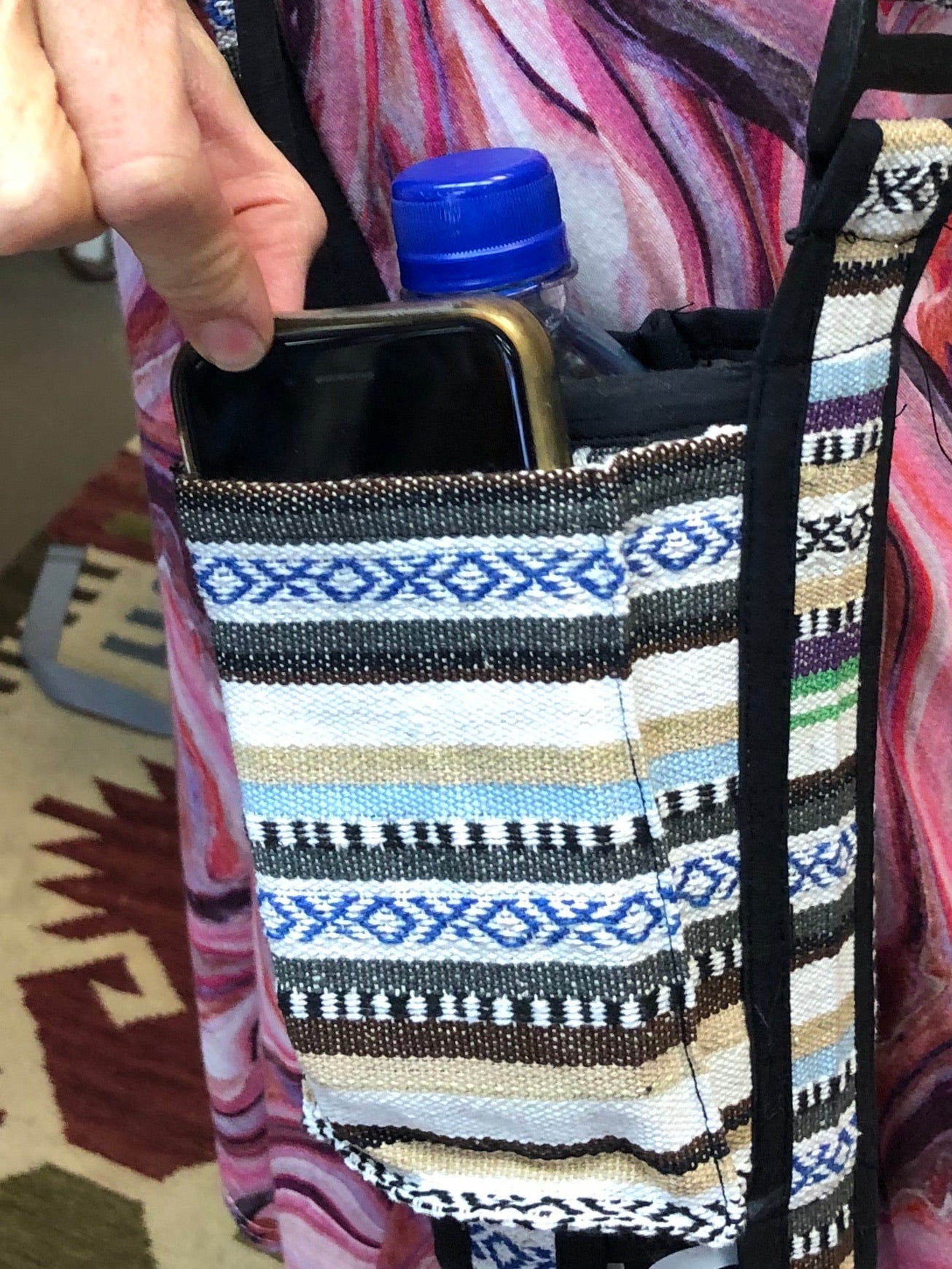 Cross body water bottle and phone holder.